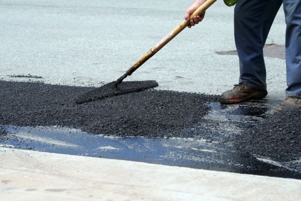 Asphalt patching project in a parking lot