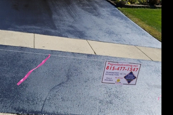 A recently sealed driveway by Pagni’s Sealcoating