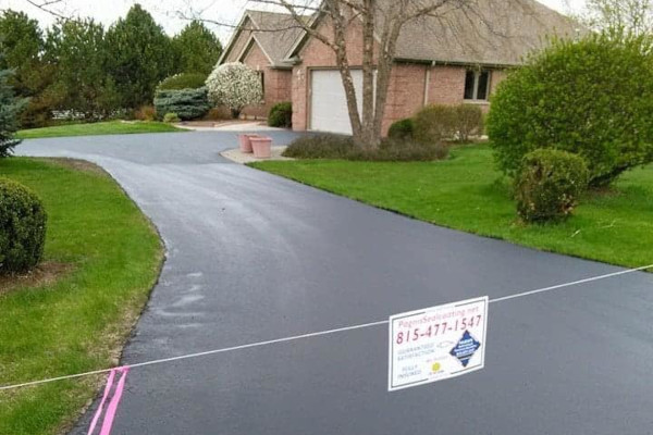 Finished driveway sealcoating project by Pagni’s Sealcoating