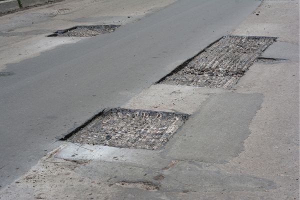 Areas of pavement have been cut out for replacement